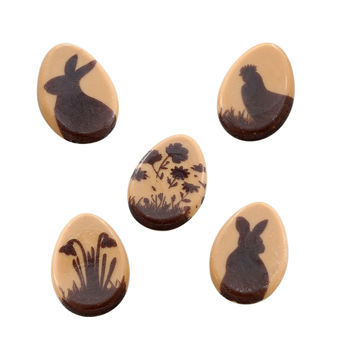 Achat en ligne Décor en chocolat : 25 oeufs de Pâques plats motifs poule, lapins et fleurs 3 x 2 cm - Alice Délice